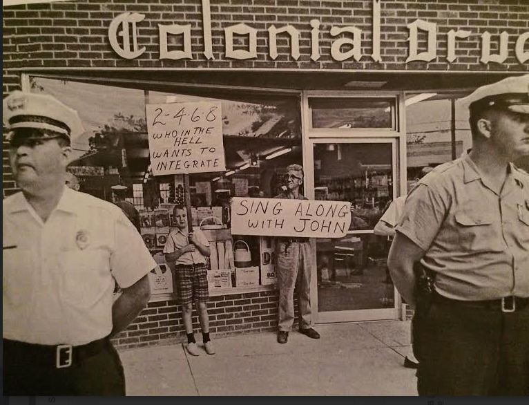 Chapel Hill Police stand between civil rights demonstrators and counter-protesters at Colonial Drug