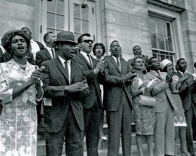Demonstrators gather on the steps of the North Carolina State Capitol.