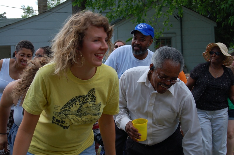 Virginia, Revels, and Pastor Troy Harrison do the electric slide